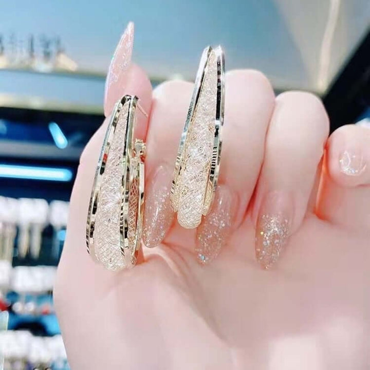 Ressa – Gedrehte ovale Creolen